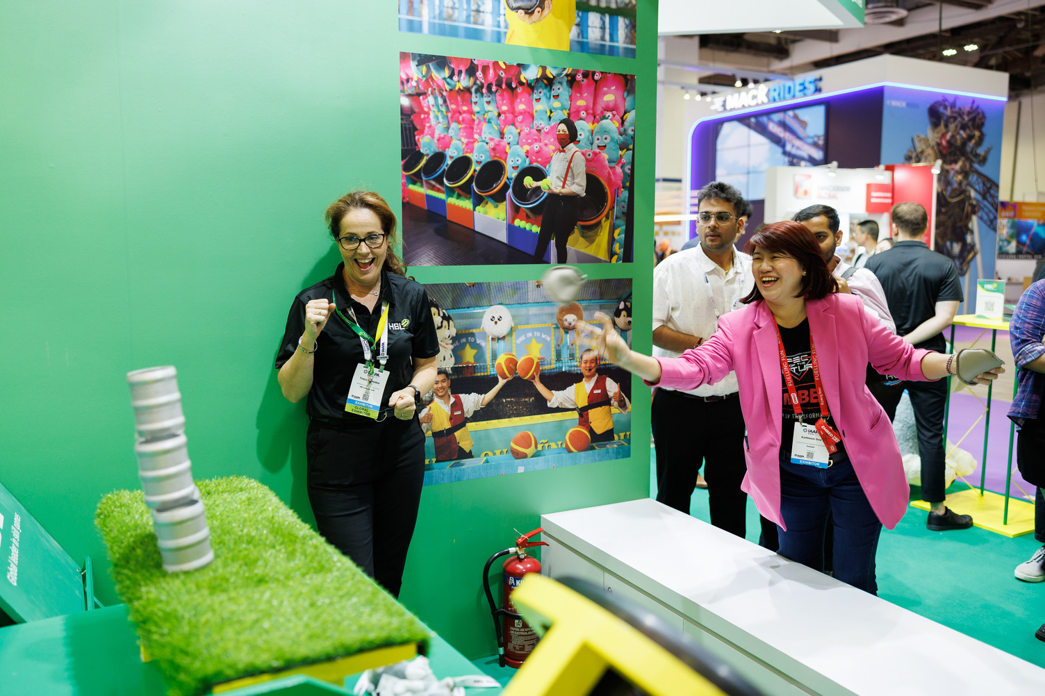 Attendees enjoying a game in a booth