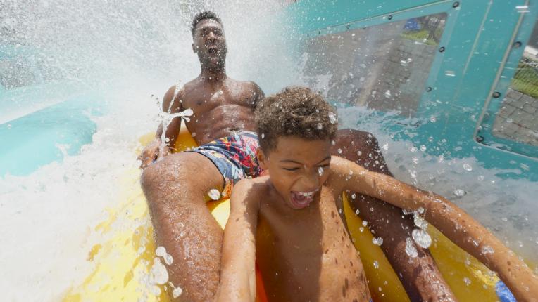 Family enjoy a water coaster