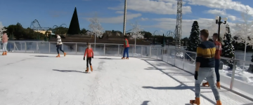 Ice skaters on a rink with SeaWorld Orlando coasters in the background