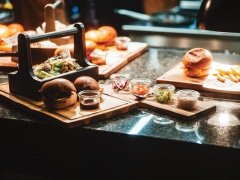 Food presentation is all part of the story of Rookburgh, where menu items arrive on cutting boards.