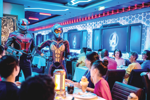 The Worlds of Marvel characters at dinner