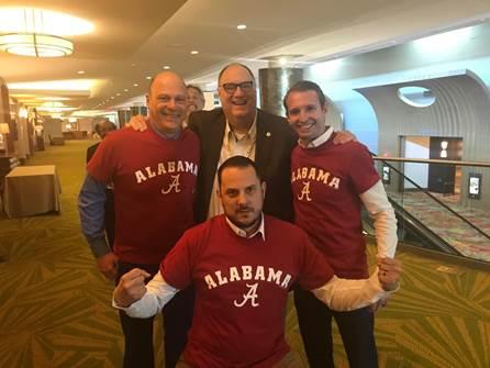 Photo of group of men in Alabama shirts