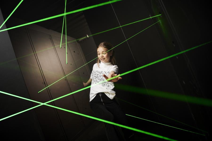 Kid going through laser maze