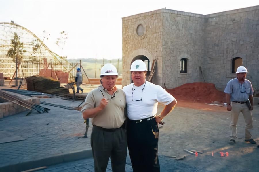 IAAPA Hall of Fame members Marcelo Gutglas and Dennis Spiegel wearing construction hats and involved in development of Brazil's Hopi Hari