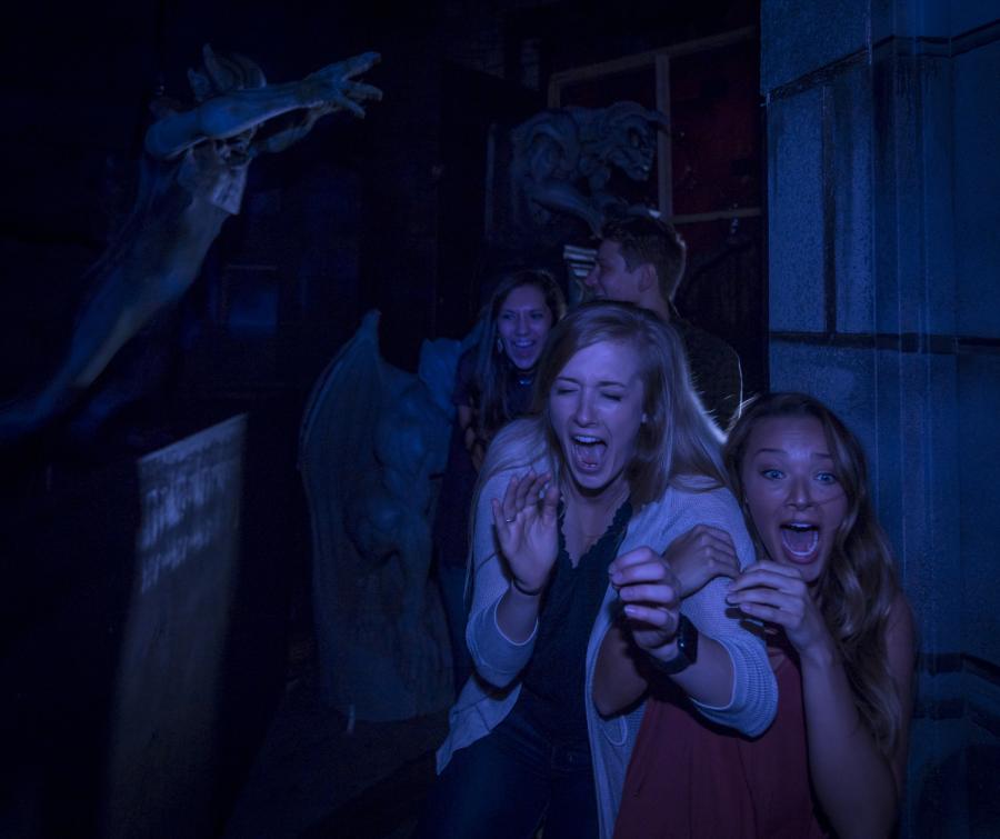 Two girls screaming in a haunted house