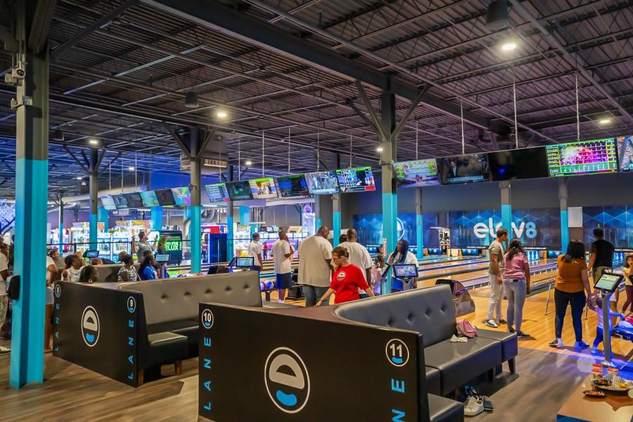 Overview of the bowling alley area inside Elev8, a family entertainment center (FEC) located inside a shopping mall