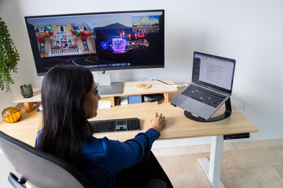 Illumix 首席执行官 Kirin Sinha 的概述，她在办公桌前通过可视屏幕工作，展示她与迪士尼乐园最新的 AR 项目合作