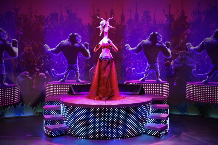 Animatronic of Gazelle from Zootopia with tigers as back-up dancers projected behind an LED screen