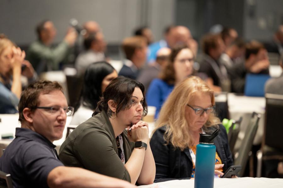 Attendees in focus and concentrating during the "Finding Your Revenue" EDUSession held at IAAPA Expo 2023