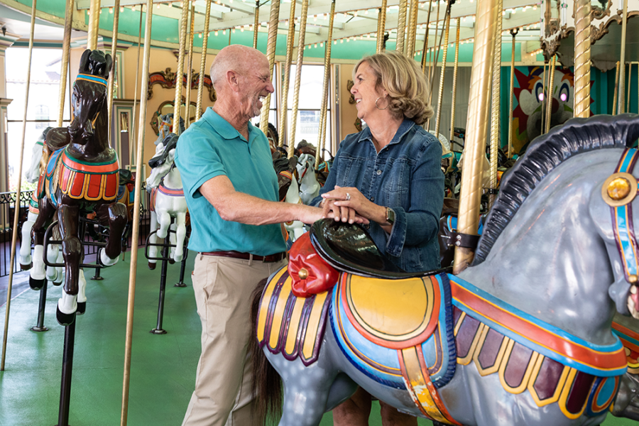 Ken Whiting and wife on carousel 