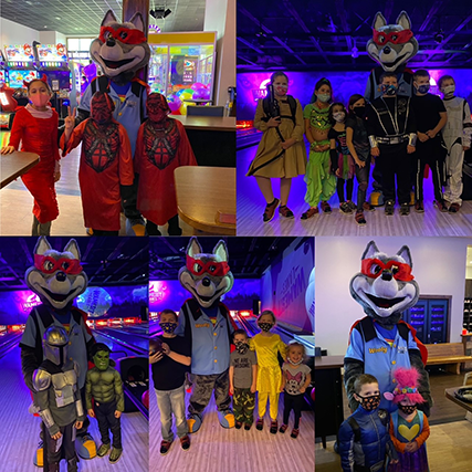Costumed character and guests at bowling alley