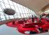The Sunken Lounge at the TWA Hotel sports a retro look. Visitors can enjoy 1960s cocktail favorites and look out the windows to see the 1958 "Connie" plane.