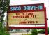 Movie theater marquee sign for Saco Drive-In, located in Maine. Marquee sign text: Fri to Tues, Spiderman FFH and John Wick 3