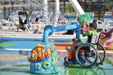 Boy in a wheelchair at a waterpark
