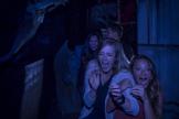 Two girls screaming in a haunted house