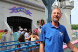 Cory Hutchinson standing in front of a ride queue at Funtown Splashtown USA